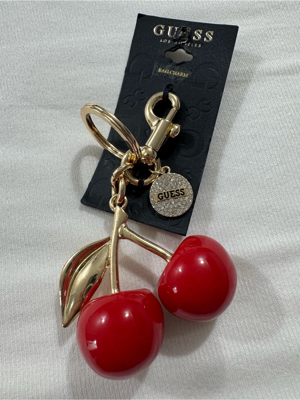 GUESS Cherry Bag Charm and Keychain in Gold Tone
